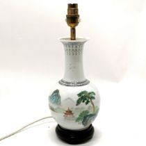 Hand painted oriental lamp base with script to reverse measuring 35cm high. Wooden base has split to