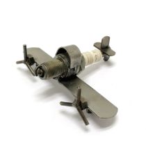 Novelty scratch built aeroplane made of steel and a sparkplug 9cm x 12cm