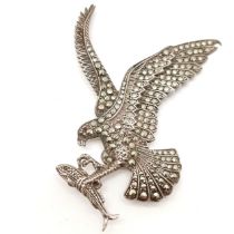 Silver marked marcasite & red stone eagle carrying fish brooch - 7.5cm & 23g total weight