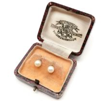 Pair of 9ct gold mounted pearl stud earrings (1.3g total weight) in a retail box P.Orr & Sons (