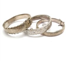 3 x silver hallmarked bangles - wax filled bangle has detached safety chain & the other 2 have dents