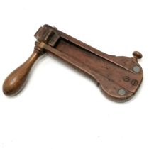 Antique wooden mahogany rattle measuring 20cm long x 15cm high. Has losses to wood at one end.