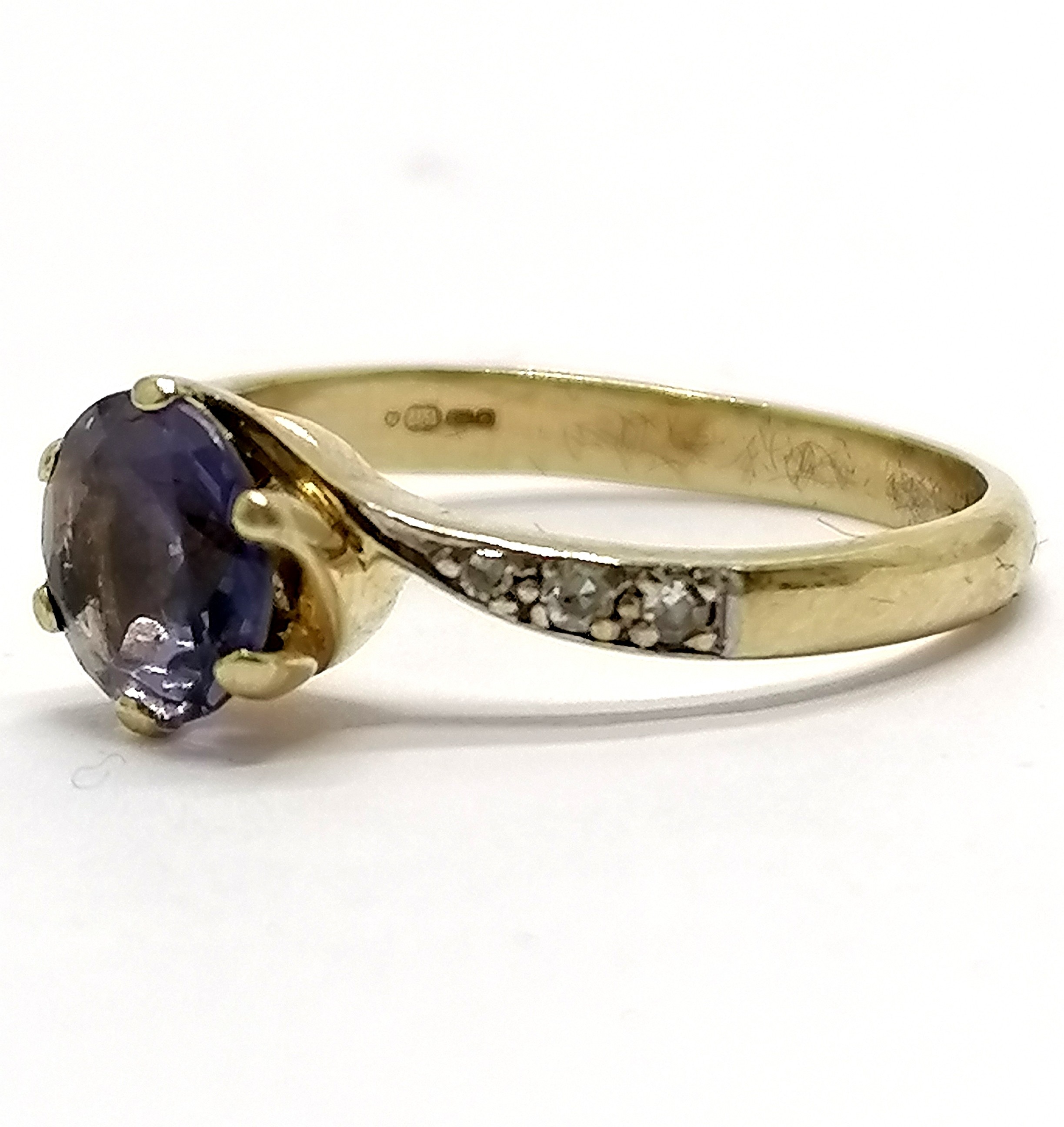 9ct hallmarked gold iolite (?) / diamond crossover ring - size L & 1.9g total weight - stone has - Image 3 of 3