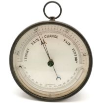 Antique cased barometer 12.5cm diameter x 6 cm deep, in used condition.