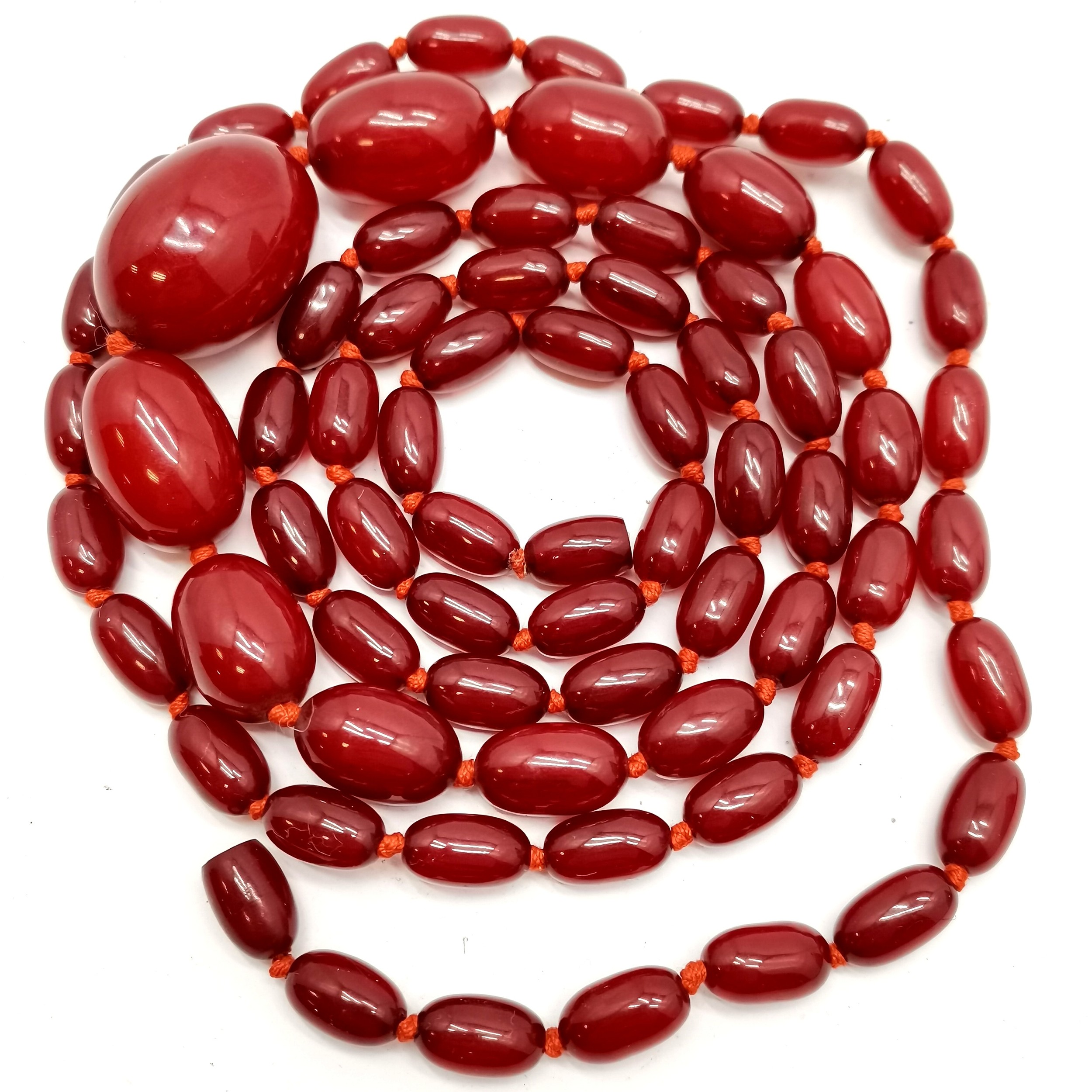 Long strand of cherry amber graduated beads - 110cm (largest bead 3cm) & 64g total weight ~ clasp