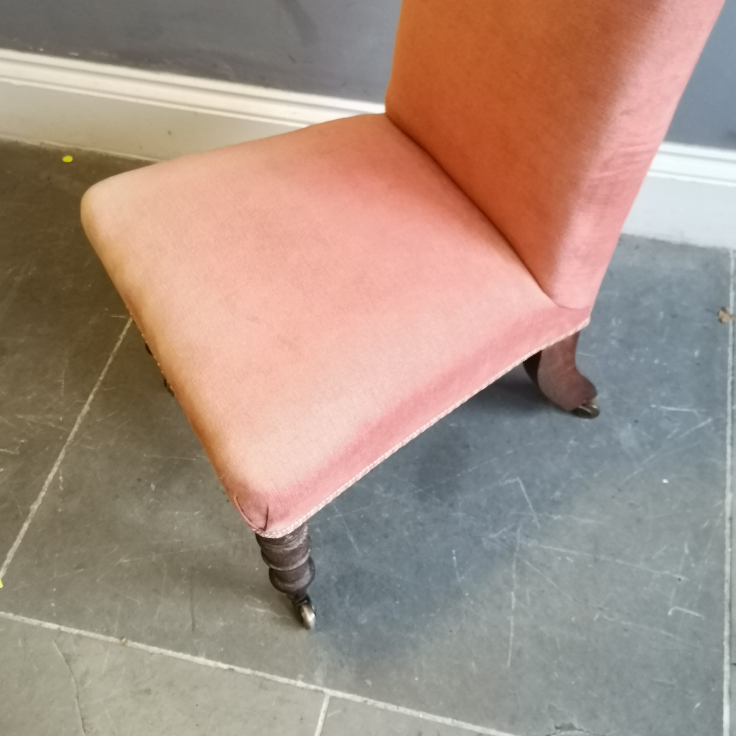 Antique walnut framed high back nursing chair,on original brass castors, upholstered in a coral - Image 3 of 3