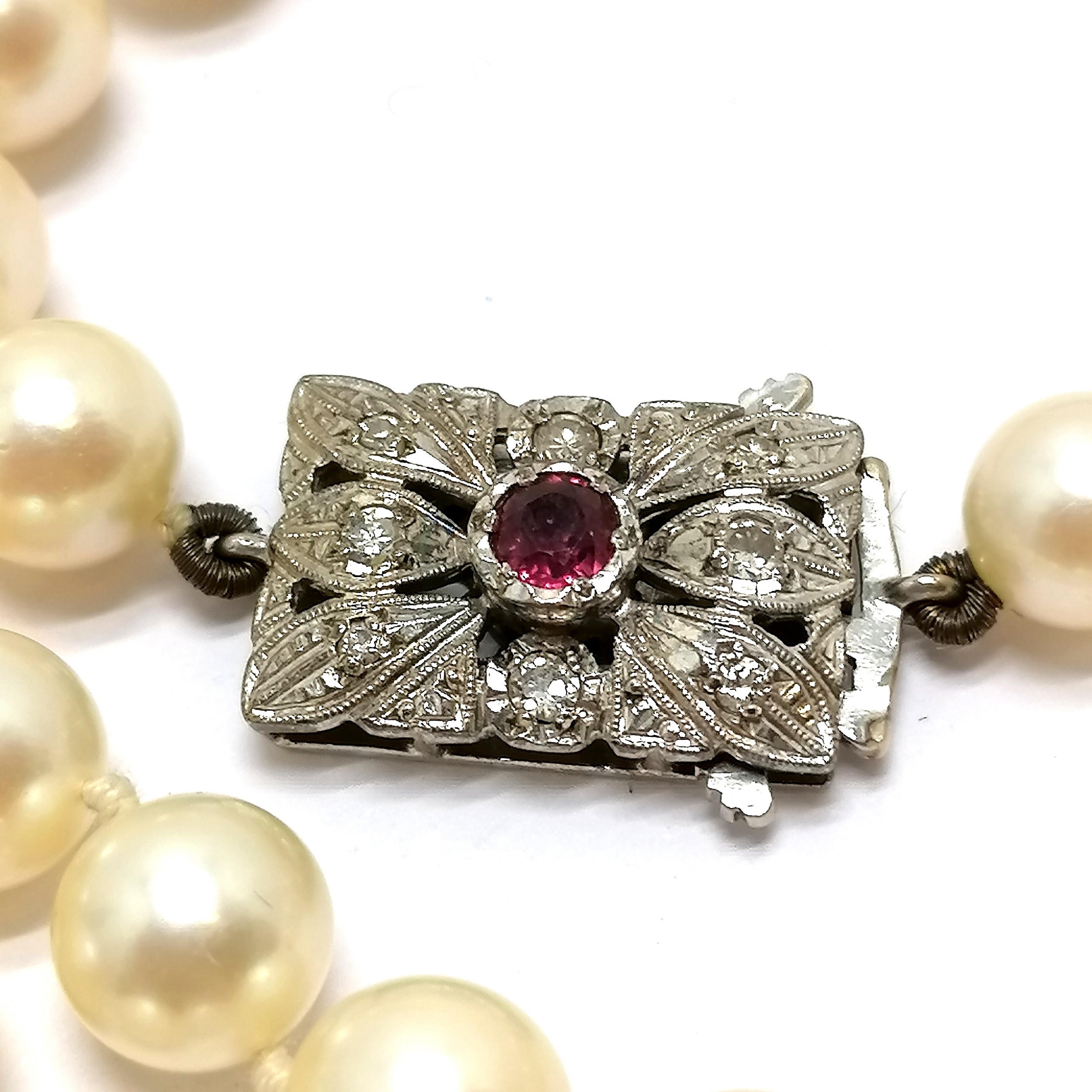 Long strand of pearls with 9ct hallmarked white gold clasp set with diamonds + centre ruby ~ - Image 2 of 5
