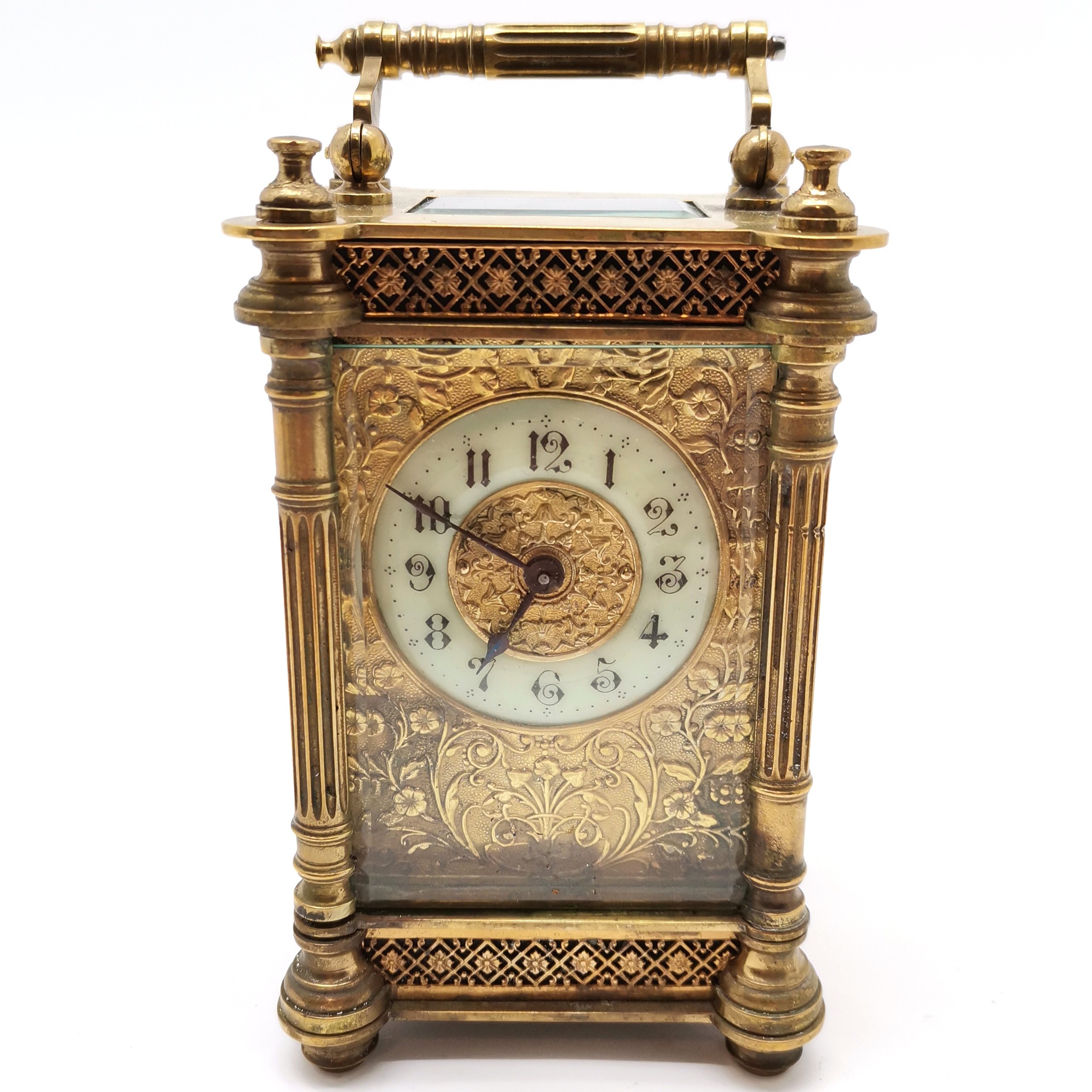 Antique brass cased carriage clock with fluted column detail - 13cm high & running at time of