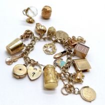 9ct gold charm bracelet with qty of charms inc Nuvo carry cot (opening to reveal baby), 18ct '13',