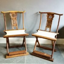 Pair of Chinese folding hardwood carved chairs with sisal seats. H97cm x D41cm x L55cm. In used