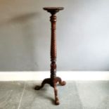 Reproduction mahogany Torchere stand, with spiral carved decoration terminating on carved tripod
