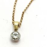 9ct hallmarked gold diamond pendant (4.5mm diameter) on a 9ct hallmarked gold 40cm chain - total