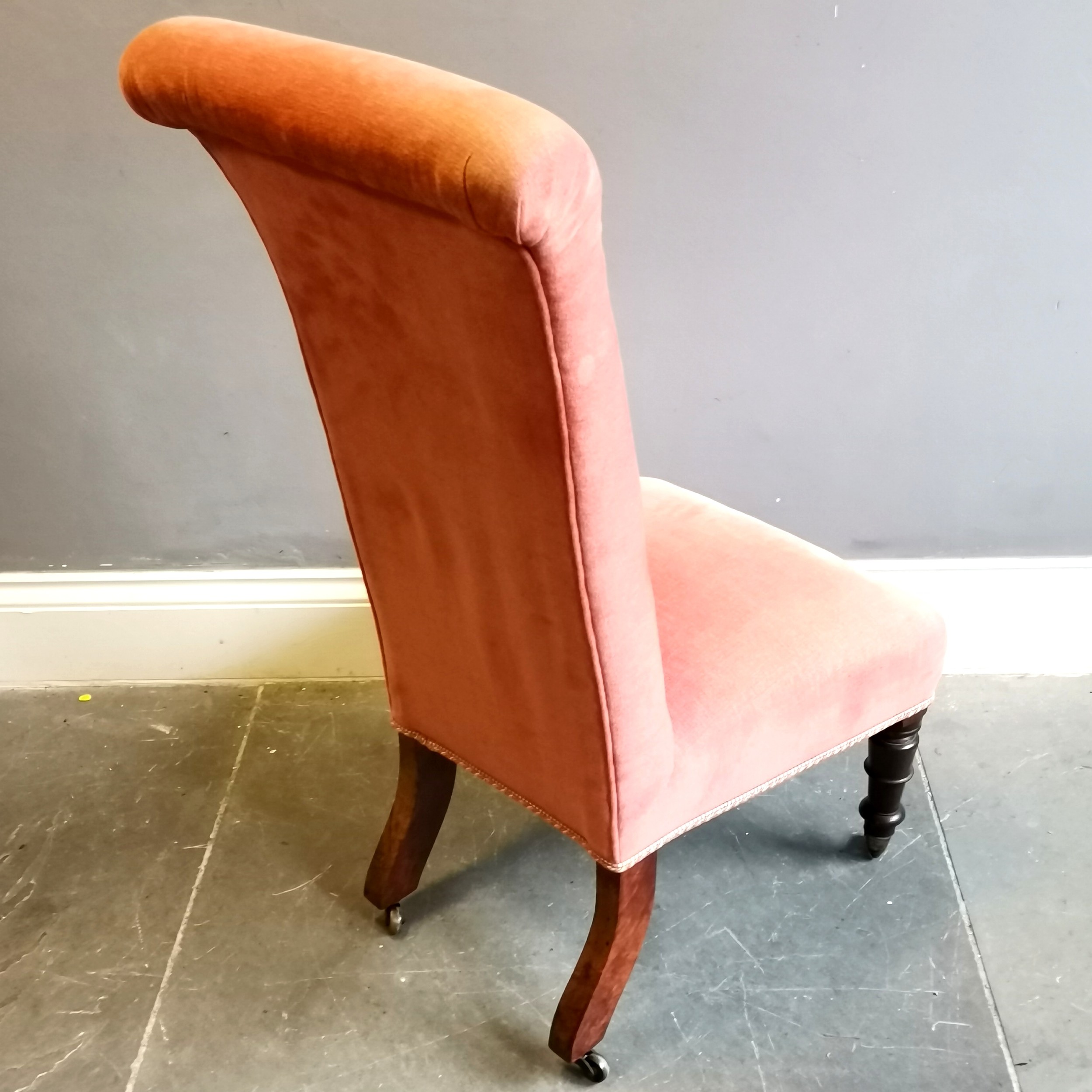 Antique walnut framed high back nursing chair,on original brass castors, upholstered in a coral - Image 2 of 3