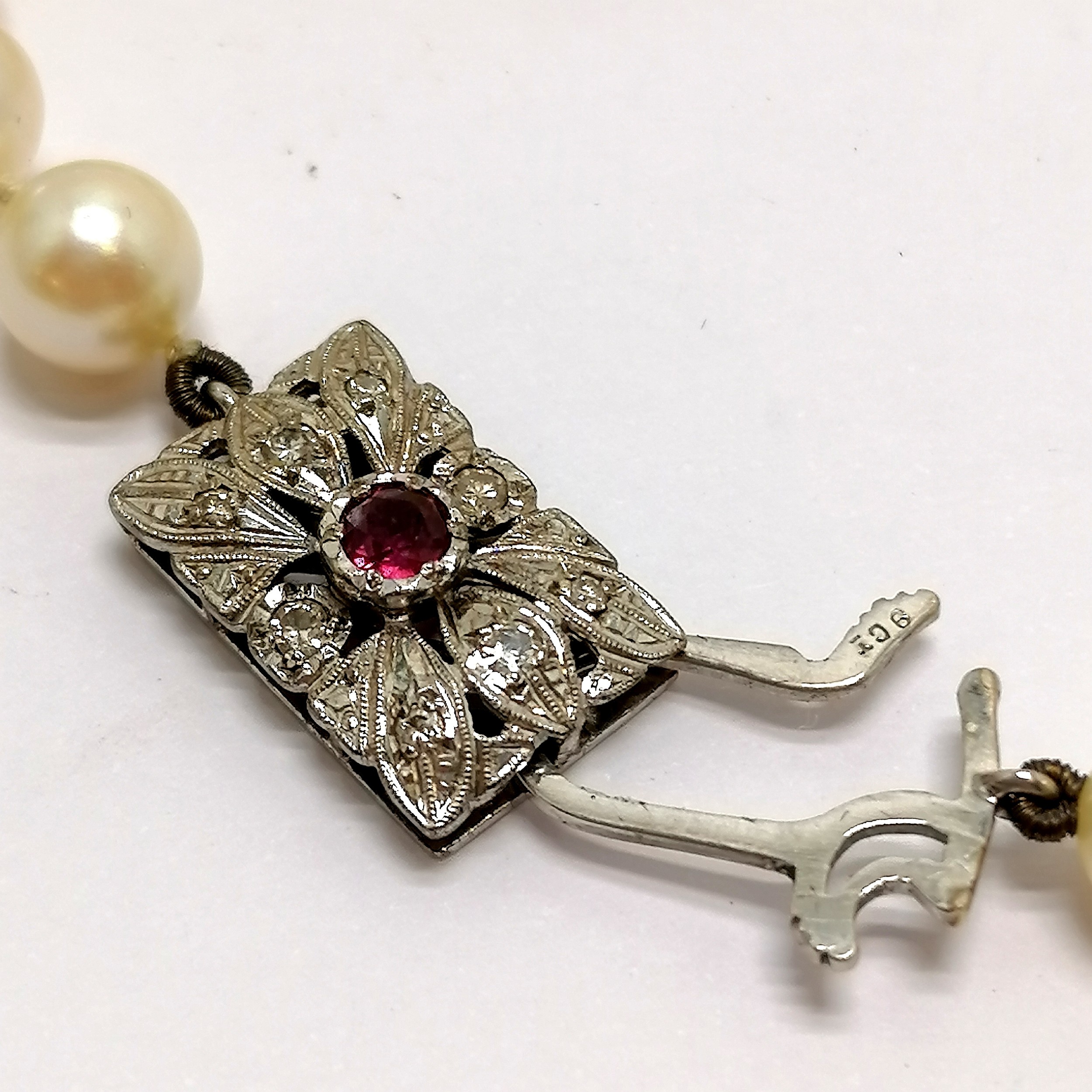 Long strand of pearls with 9ct hallmarked white gold clasp set with diamonds + centre ruby ~ - Image 3 of 5