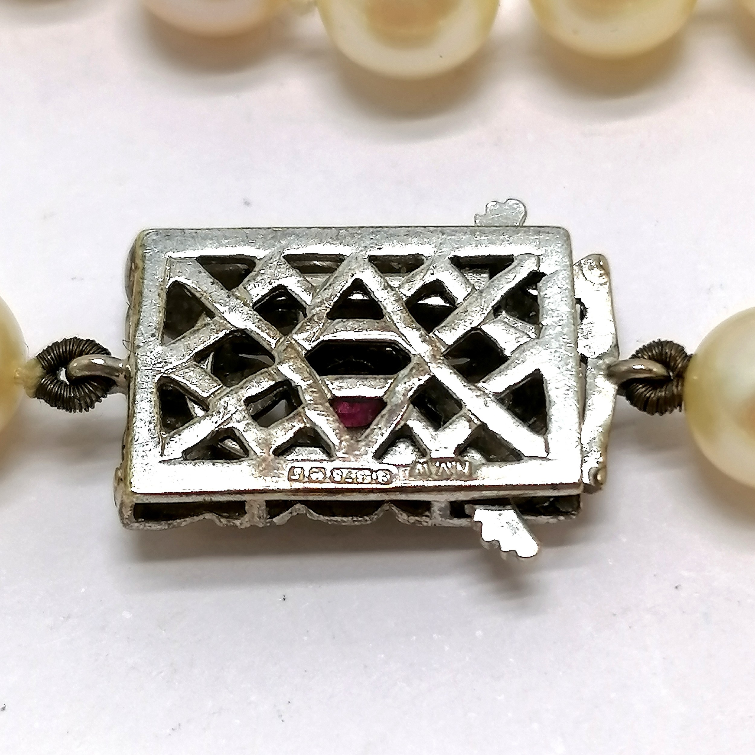 Long strand of pearls with 9ct hallmarked white gold clasp set with diamonds + centre ruby ~ - Image 4 of 5