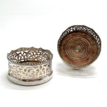 Pair of antique bottle coasters with turned wooden bases and high pierced gallery detail - 14cm