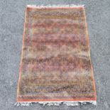 Terracotta wool Turkish grounded rug by Turkoman London ~ 171cm x 114cm - no obvious signs of damage