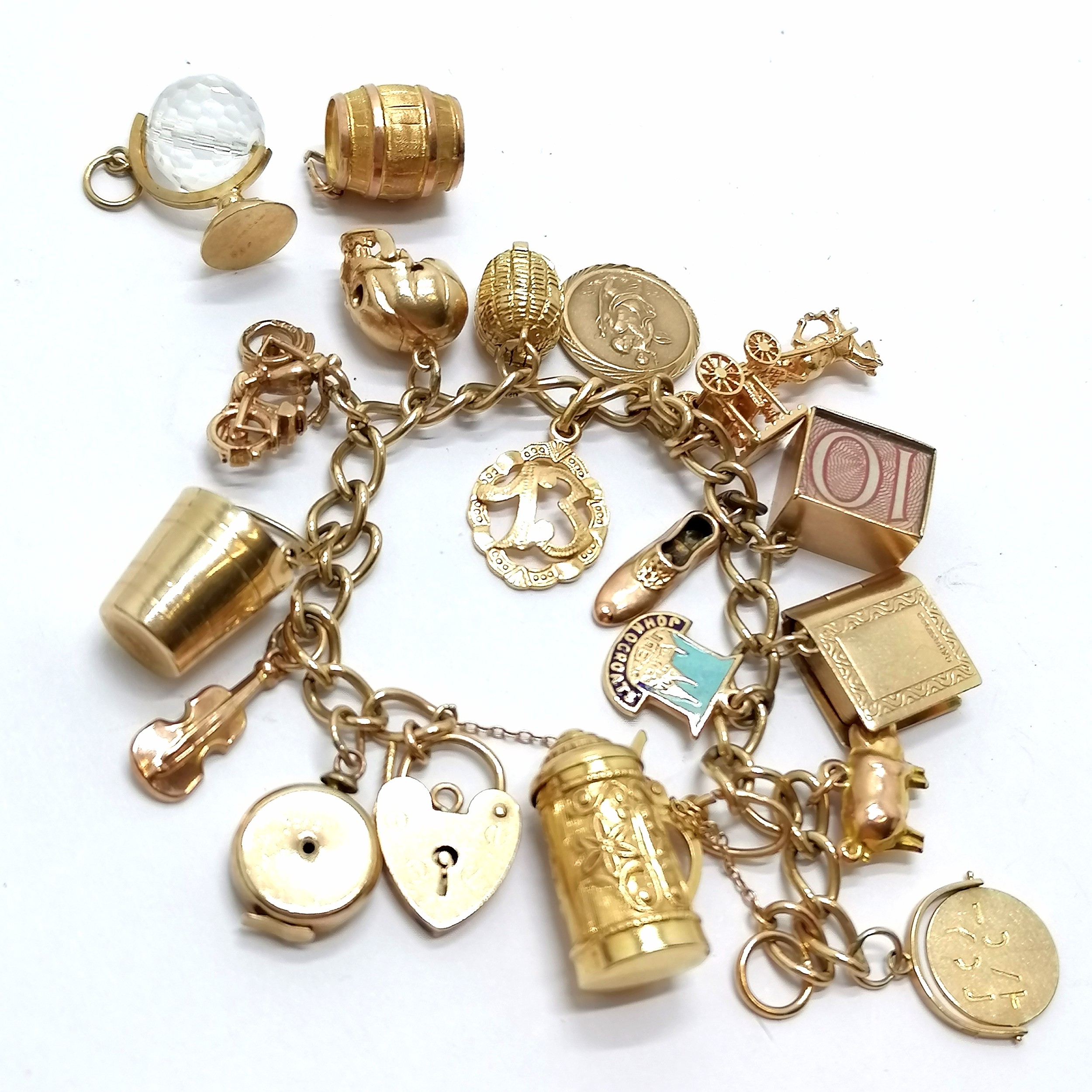 9ct gold charm bracelet with qty of charms inc Nuvo carry cot (opening to reveal baby), 18ct '13', - Image 2 of 2