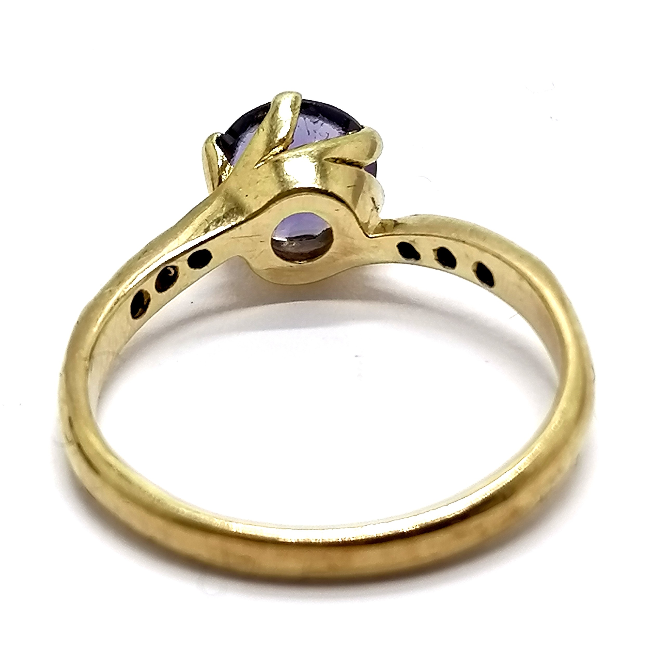 9ct hallmarked gold iolite (?) / diamond crossover ring - size L & 1.9g total weight - stone has - Image 2 of 3