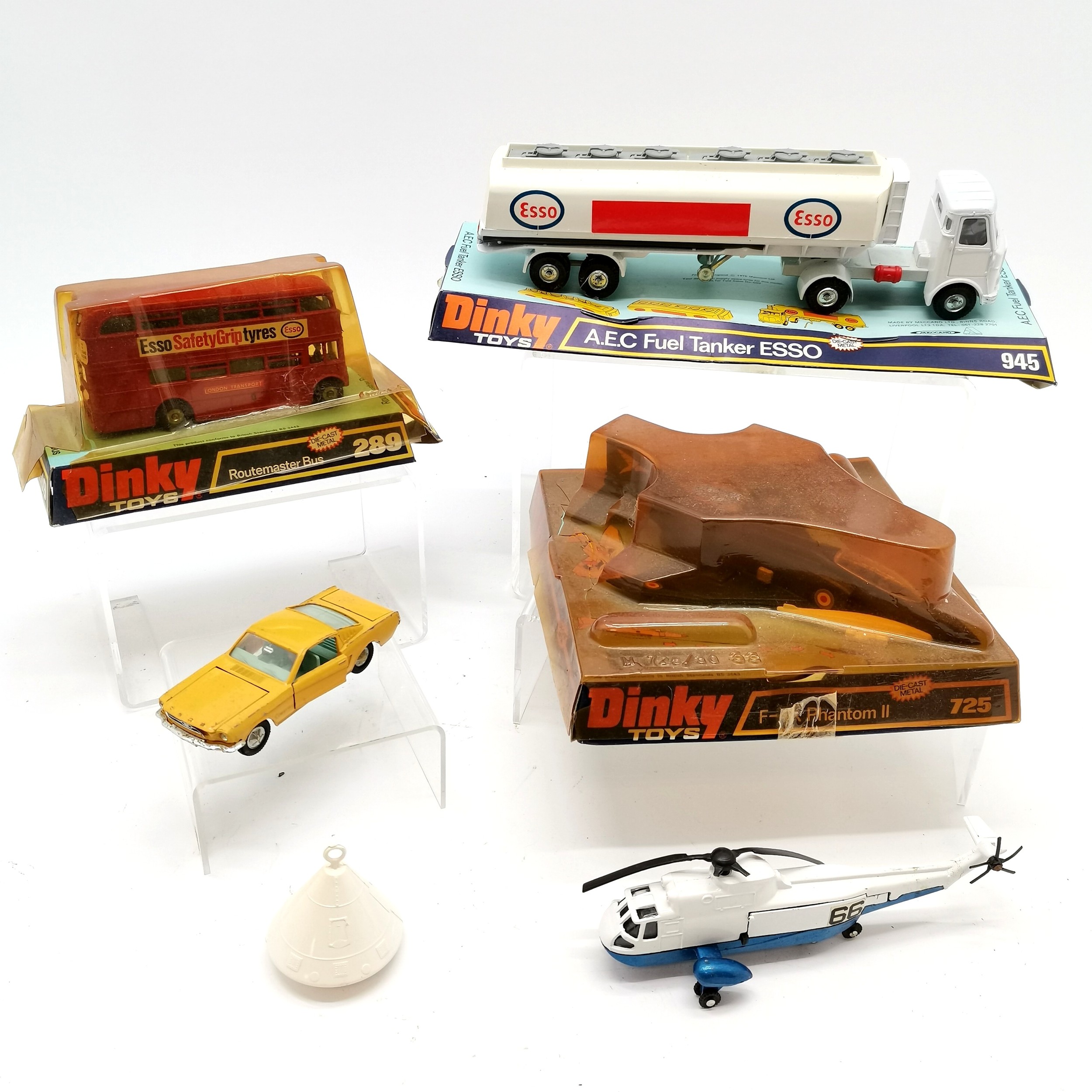 Collection of boxed and unboxed Dinky toys including 725 F-4K Phantom II, 289 Routemaster bus, A.E.C