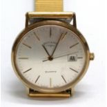 9ct gold cased Rotary gents quartz wristwatch (32mm case with dedication) on a gold plated strap