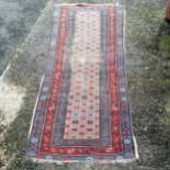 Hand woven wool rug with blue ground - 100cm x 205cm ~ has obvious signs of wear