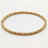 9ct hallmarked gold rope twist bangle with extending white gold mechanism - 4.5g - SOLD ON BEHALF OF