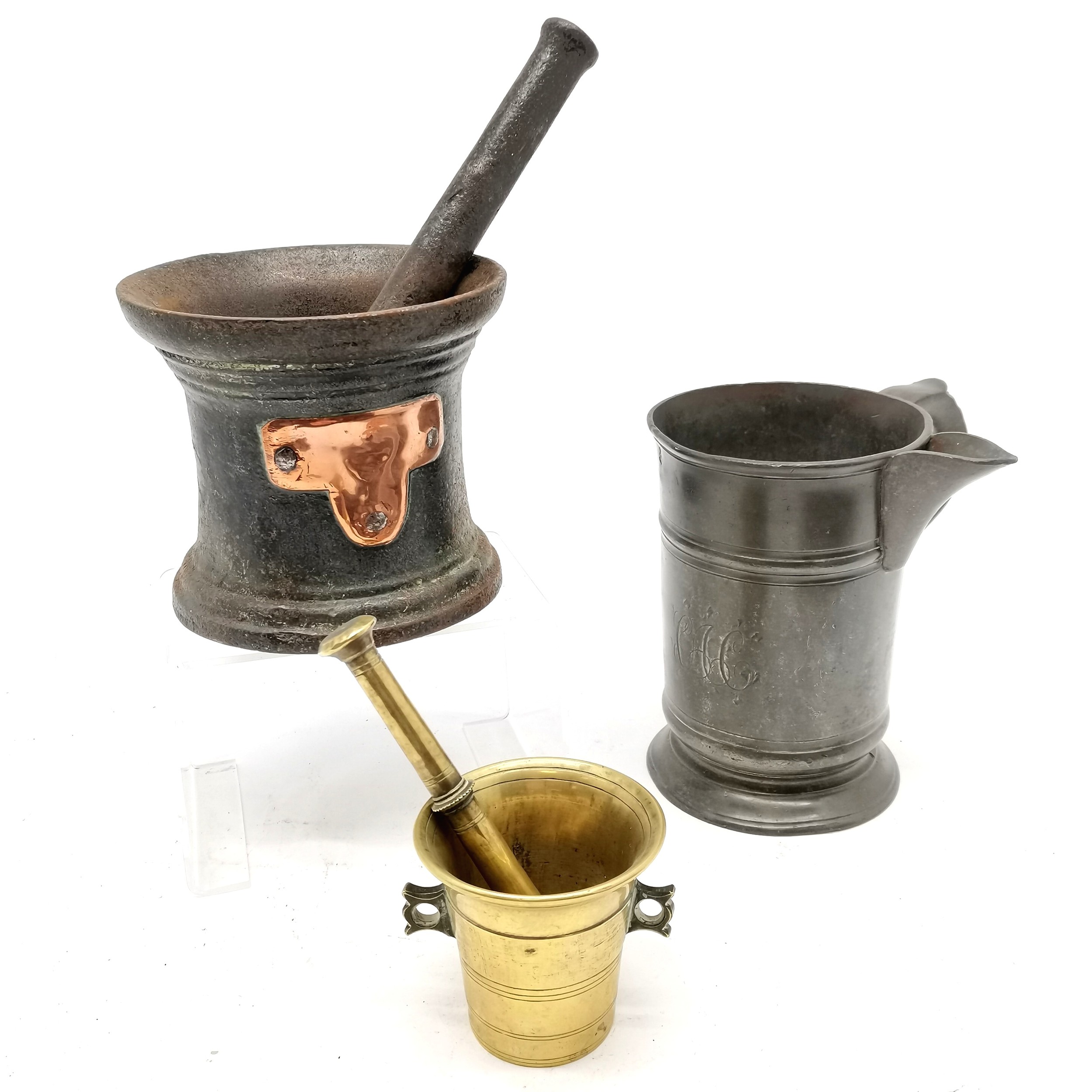 2 x antique pestles and mortars - largest 14.5cm diameter x 12.5cm high t/w antique pewter quart jug