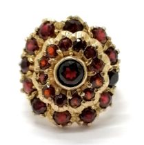 9ct hallmarked gold garnet cluster ring - size L & 8.1g total weight ~ has old repair to panel of