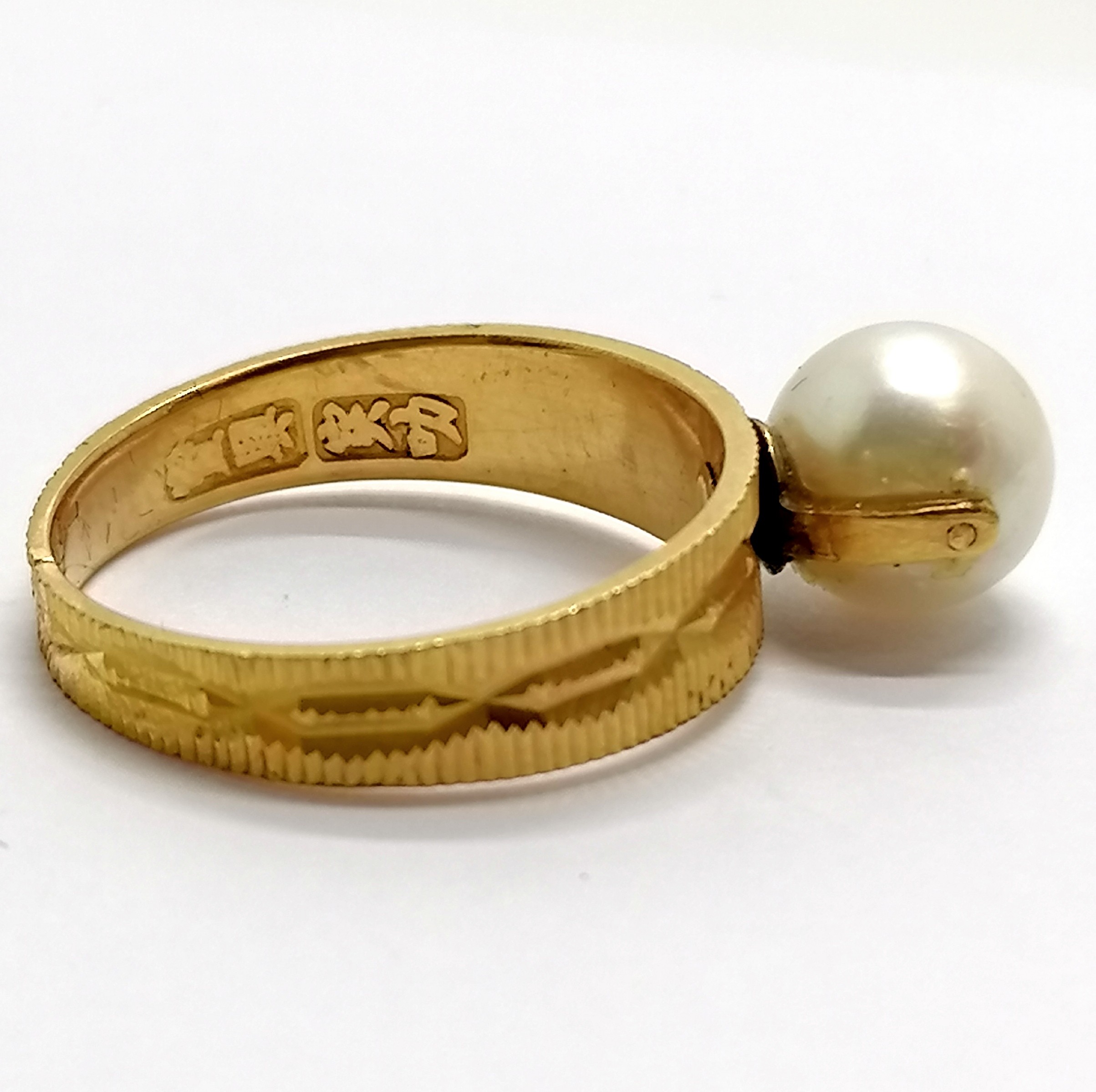 Chinese high carat gold (touch tests as 22ct) ring set with a pearl (8mm diameter) - the shank is