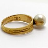 Chinese high carat gold (touch tests as 22ct) ring set with a pearl (8mm diameter) - the shank is