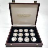 12 x encapsulated Queen Mother silver proof coins from around the Commonwealth in wooden case