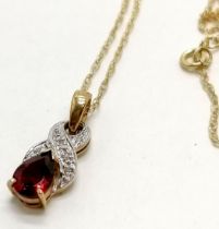 9ct hallmarked gold diamond / garnet set pendant on a 9ct marked gold fine 40cm neckchain - 1.7g