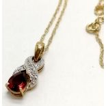 9ct hallmarked gold diamond / garnet set pendant on a 9ct marked gold fine 40cm neckchain - 1.7g