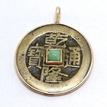 Antique Chinese unmarked gold mounted coin pendant set with jade to the centre - 2.5cm diameter &