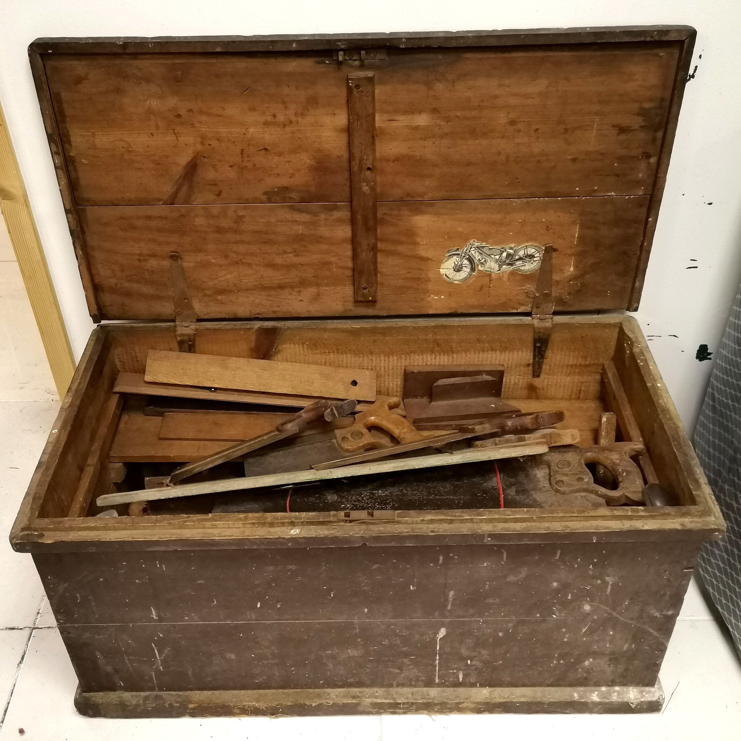 Large vintage tool chest containing a large quantity of various tools to include saws, wooden planes