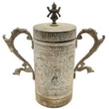 Vintage Indian brass 2 handled cylindrical vessel with lid adorned with deity finial and has