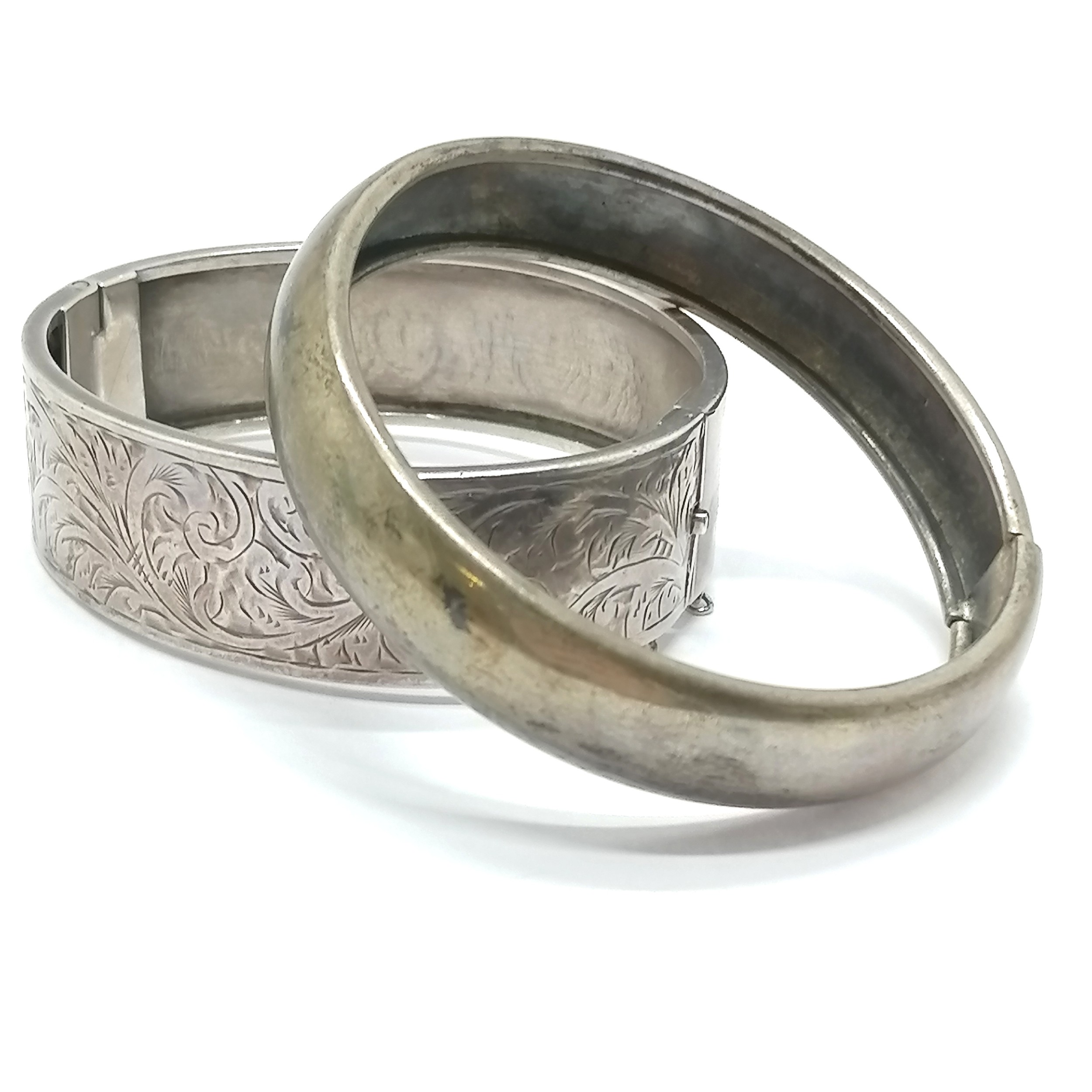 2 x silver bangles (1 unmarked & engraved has dents) - 45g