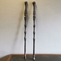 2 African Tribal hardwood carved walking sticks/staffs decorated with carved heads and decoration,
