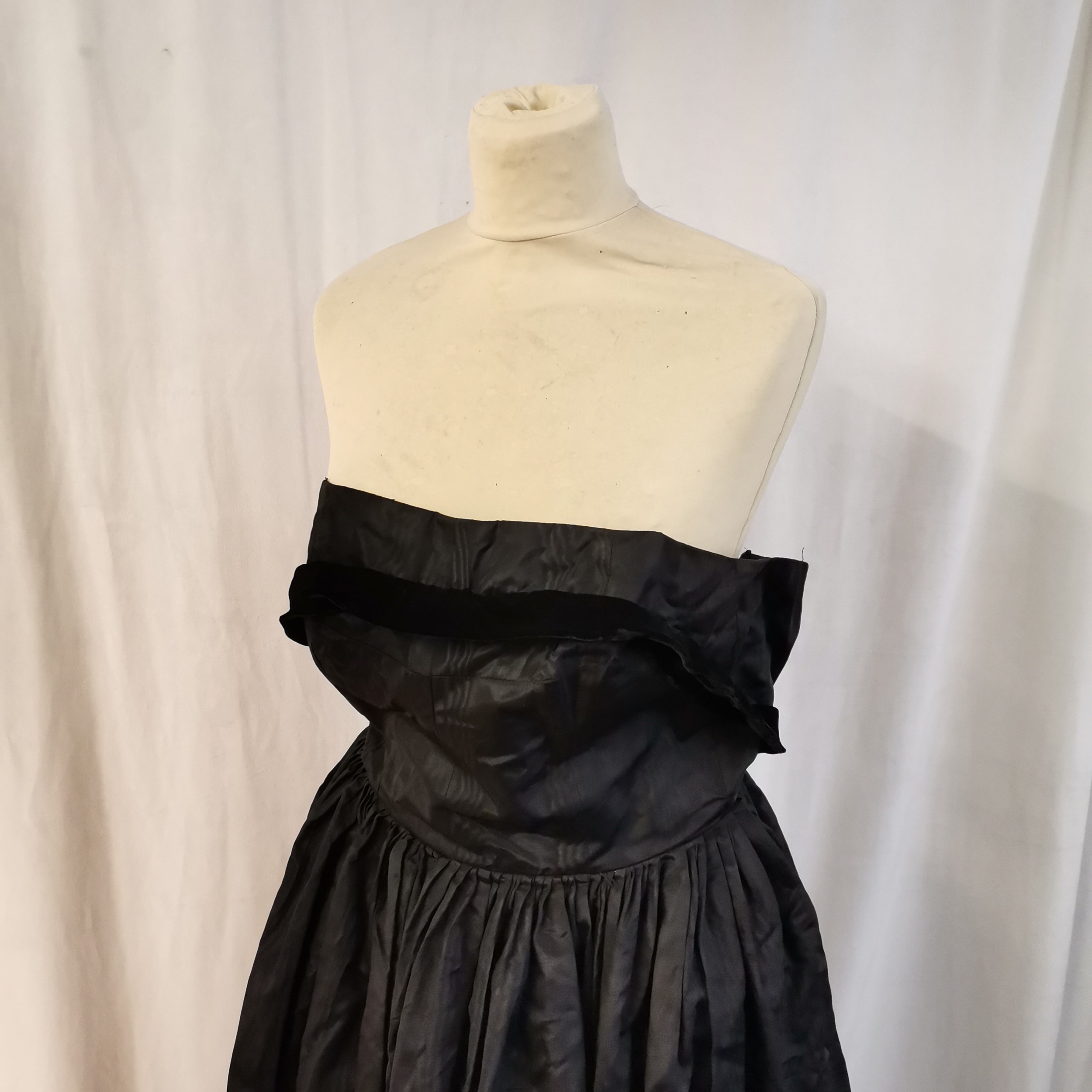 2 1950s Dresses 1 long black satin t/w 1 black velvet mid length in good worn condition. - Image 7 of 7