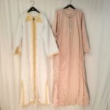 2 Middle eastern long garments in good condition one pink and one white and gold.