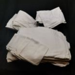 Collection of bed sheets mainly singles and pillowcases with embroidery t/w some napkins. All in
