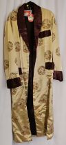 Chinese satin coat, gents gold with brown trim size 44 in unused condition