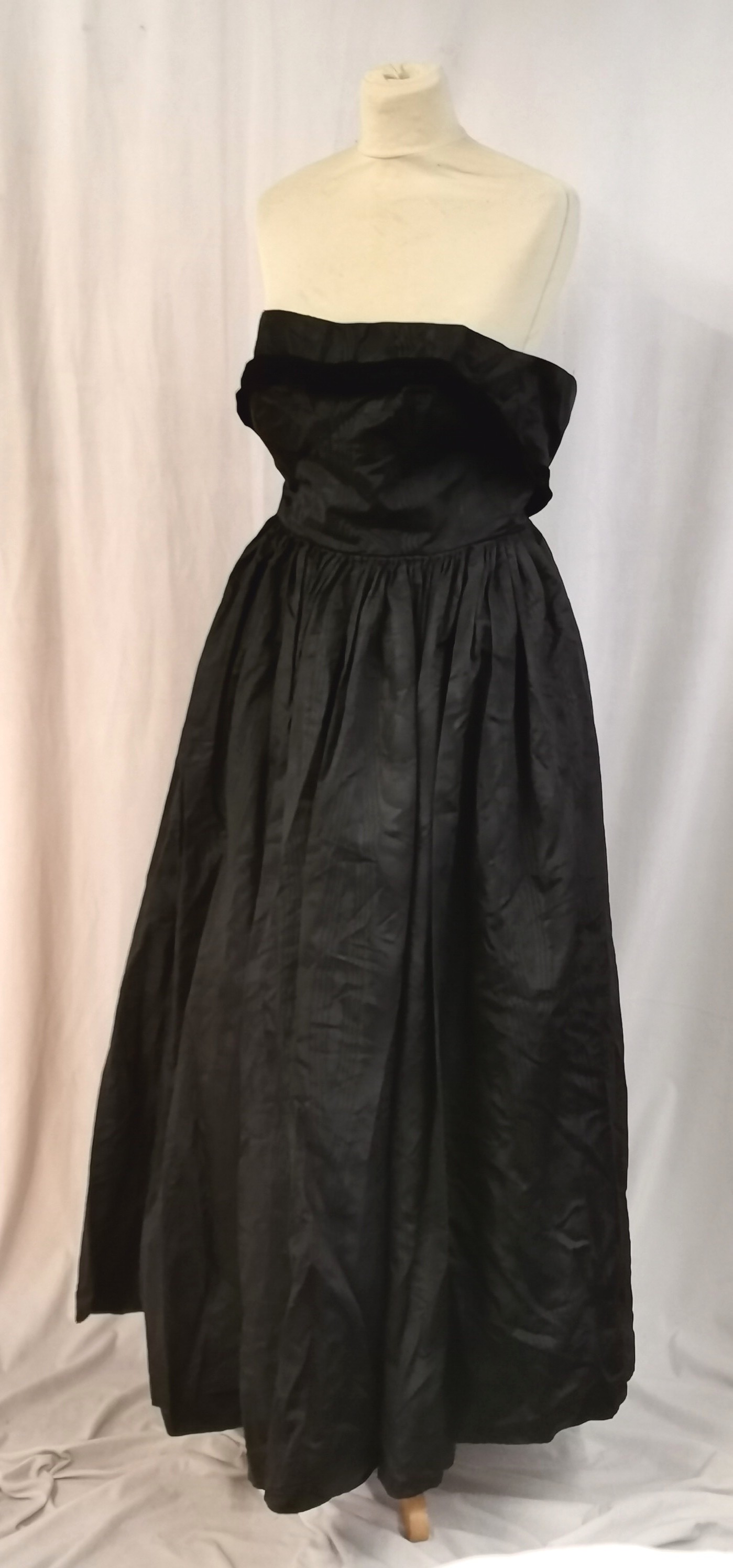 2 1950s Dresses 1 long black satin t/w 1 black velvet mid length in good worn condition. - Image 2 of 7