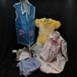 Selection of vintage children's clothes to include mainly dresses, in worn condition, 1 named.