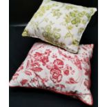 2 Floral cotton cushions 1 red, 1 green both in good condition.