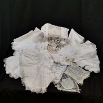 Large collection of linen and lace item to include mats, milk lace with beads, tray cloths, etc. All