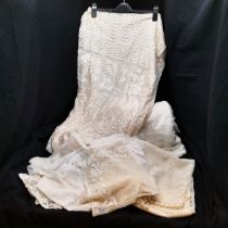 7 Pieces of white lace curtaining in good condition.