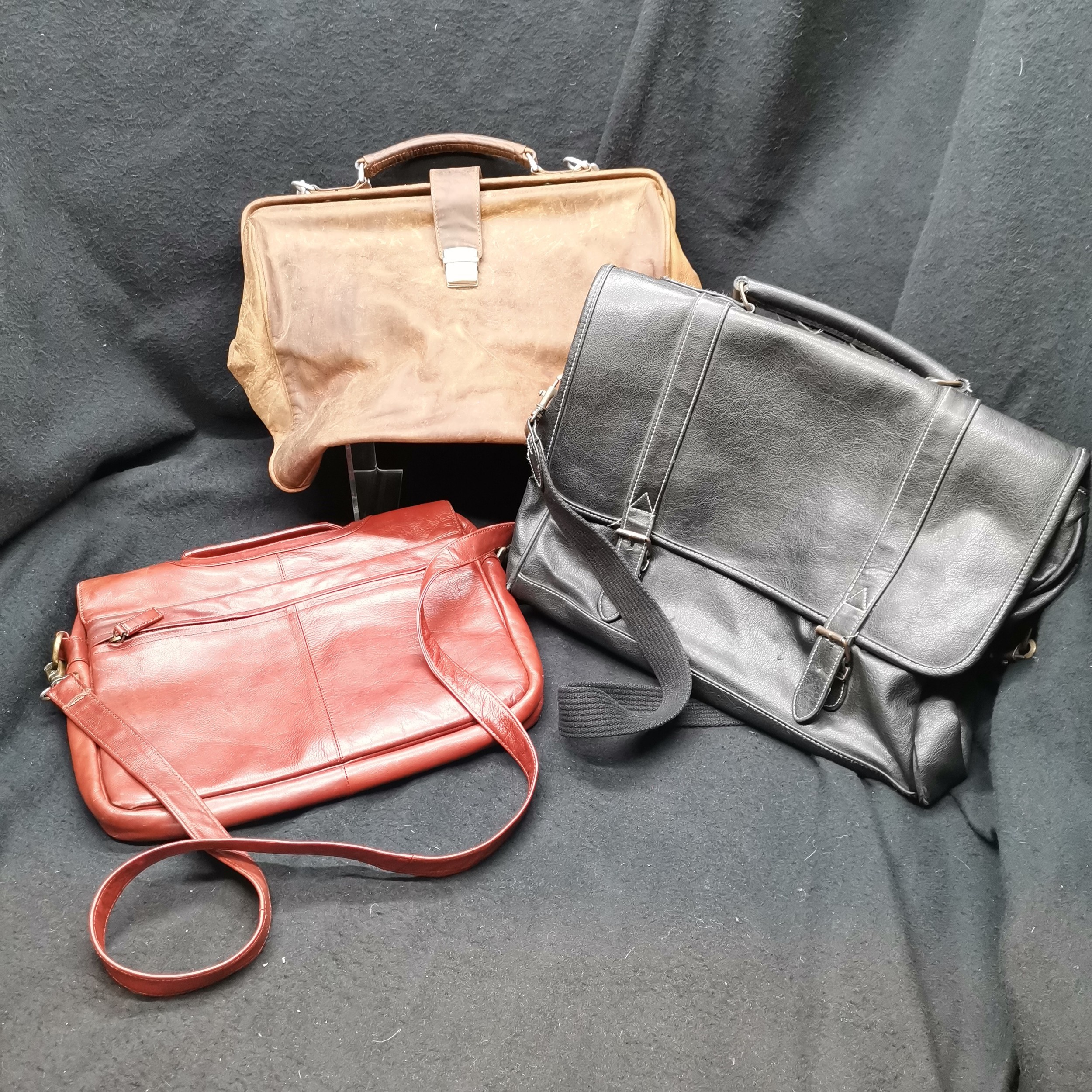 2 Leather briefcases and 1 Gladstone bag in used condition