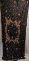 Indian black silk hanging embroidered with silver thread and beads and fringing at both ends, some